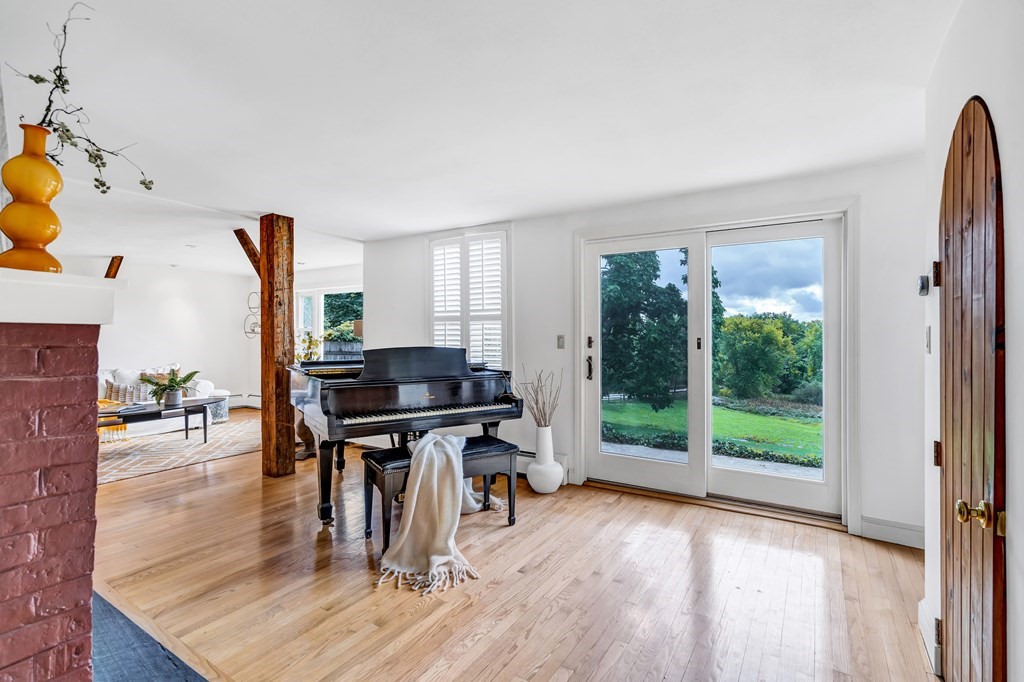 396 Plainfield Road, Unit 396 Concord, MA 01742 - Photo 4 of 24 a workspace with wooden floor
