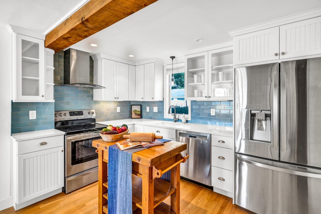 396 Plainfield Road, Unit 396 Concord, MA 01742 - Photo 9 of 24 a kitchen with stainless steel appliances granite countertop a refrigerator stove and sink