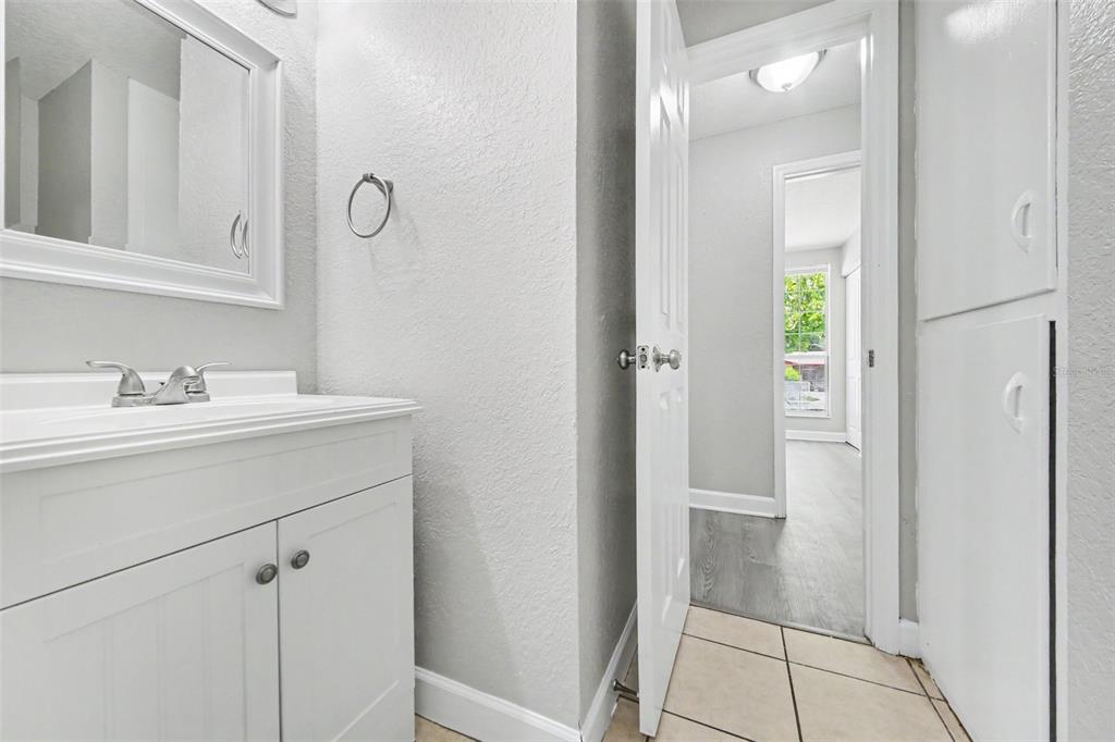 1109 Inland Street Leesburg, FL 34748 - Photo 12 of 15 a bathroom with a sink and a mirror