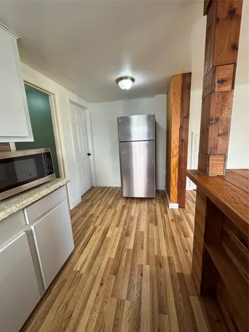 a view of a kitchen from refrigerator
