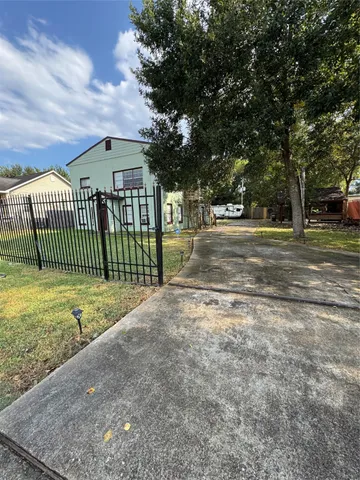 a view of a wrought iron fences in front of a house