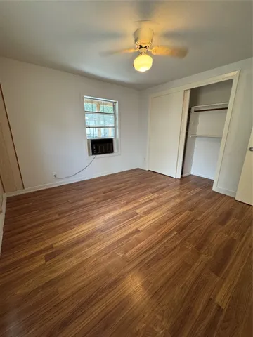 a view of a hallway to a house with white walls