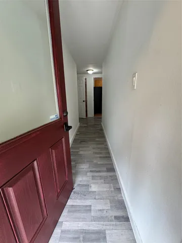 a view of a park with large trees