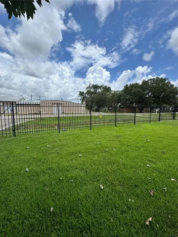 a view of outdoor space with deck and green space