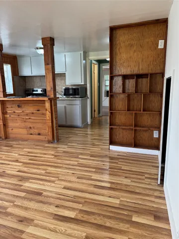 a kitchen with granite countertop a refrigerator and a stove
