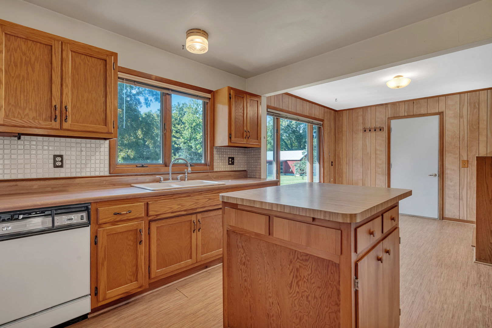 8816 Scott School Road Morris, IL 60450 - Photo 12 of 43 a kitchen with a sink stove and cabinets