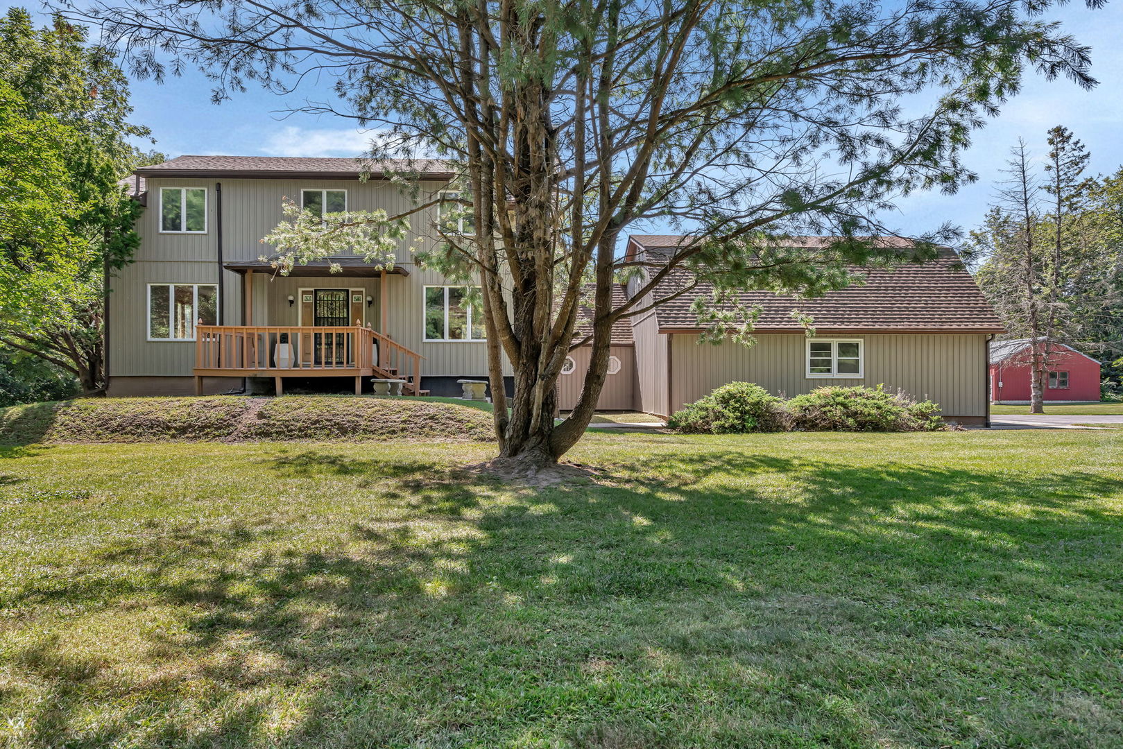 8816 Scott School Road Morris, IL 60450 - Photo 2 of 43 a front view of a house with a garden and tree