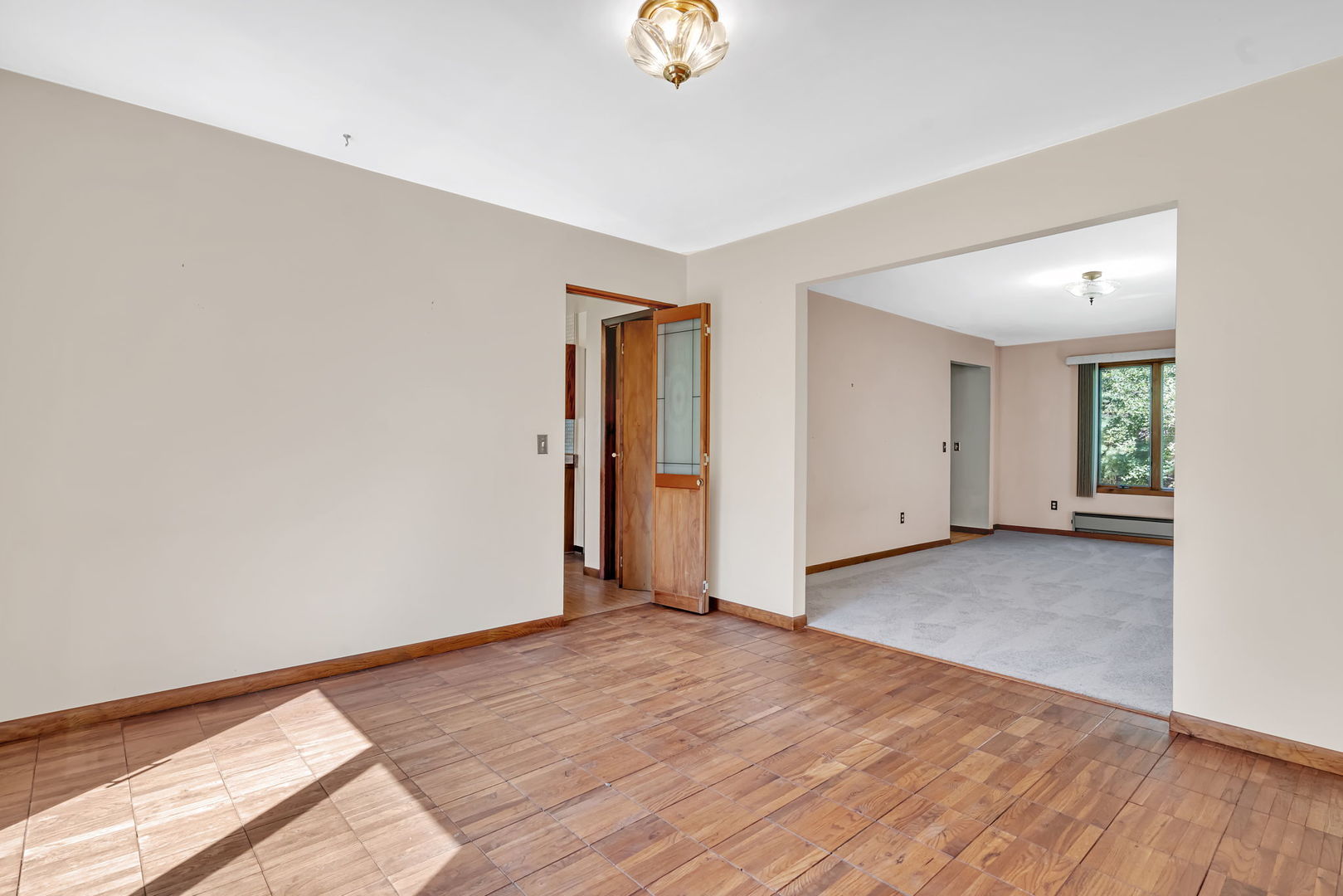 8816 Scott School Road Morris, IL 60450 - Photo 23 of 43 a view of an empty room with wooden floor and a window