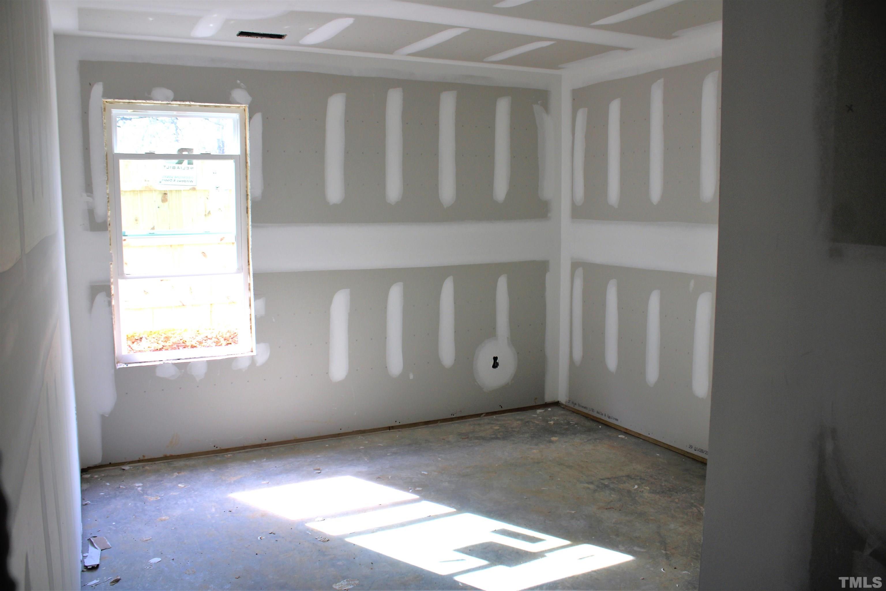 110 Alcott Street Sanford, NC 27330 - Photo 11 of 20 a view of an empty room and window