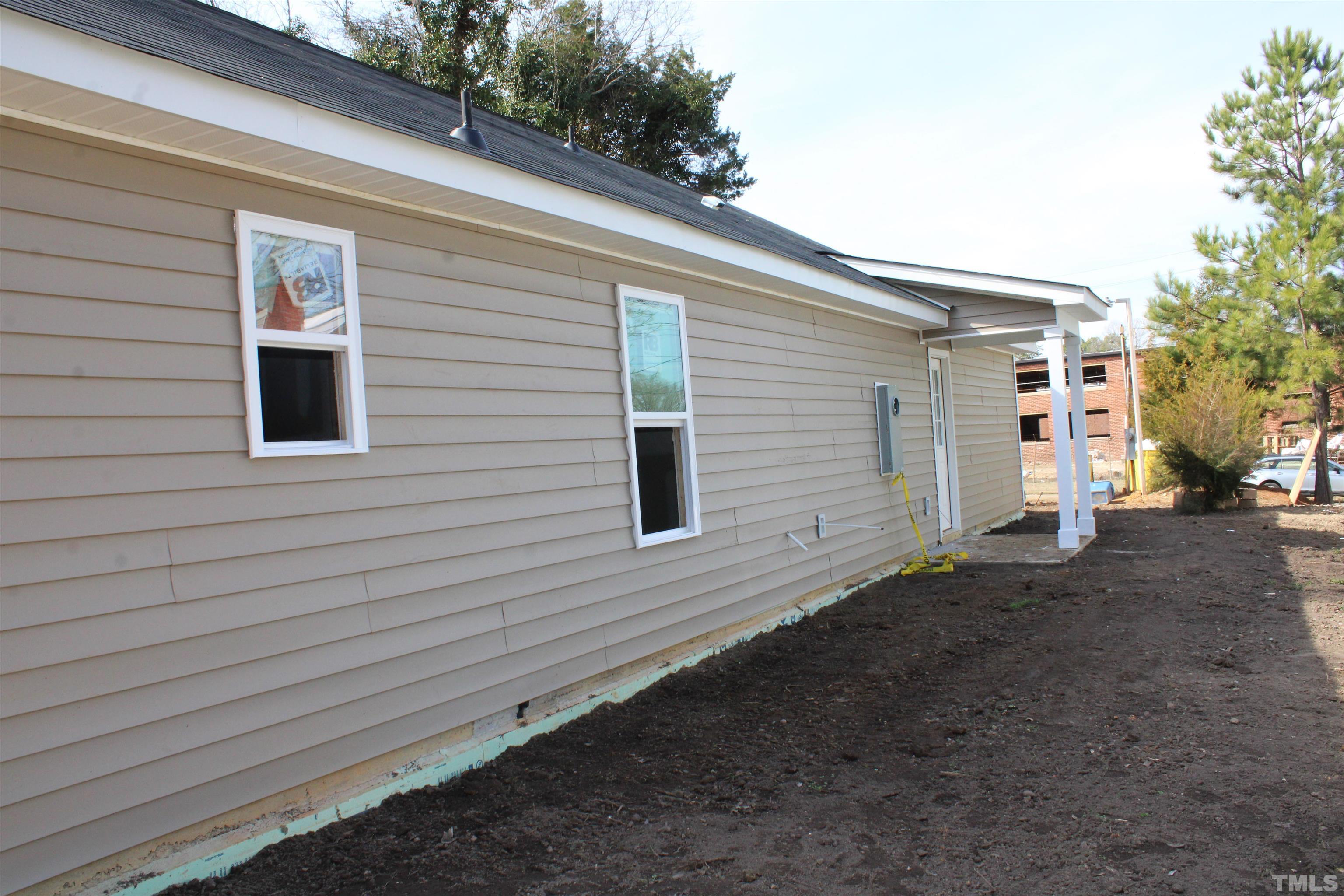 110 Alcott Street Sanford, NC 27330 - Photo 5 of 20 a view of a house with a yard