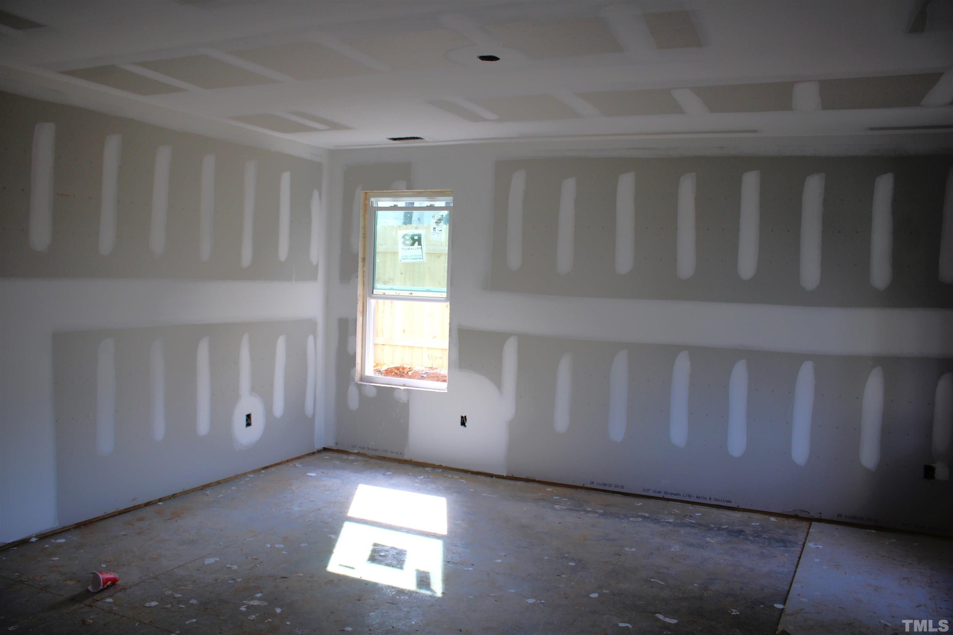110 Alcott Street Sanford, NC 27330 - Photo 6 of 20 a view of an empty room with a window