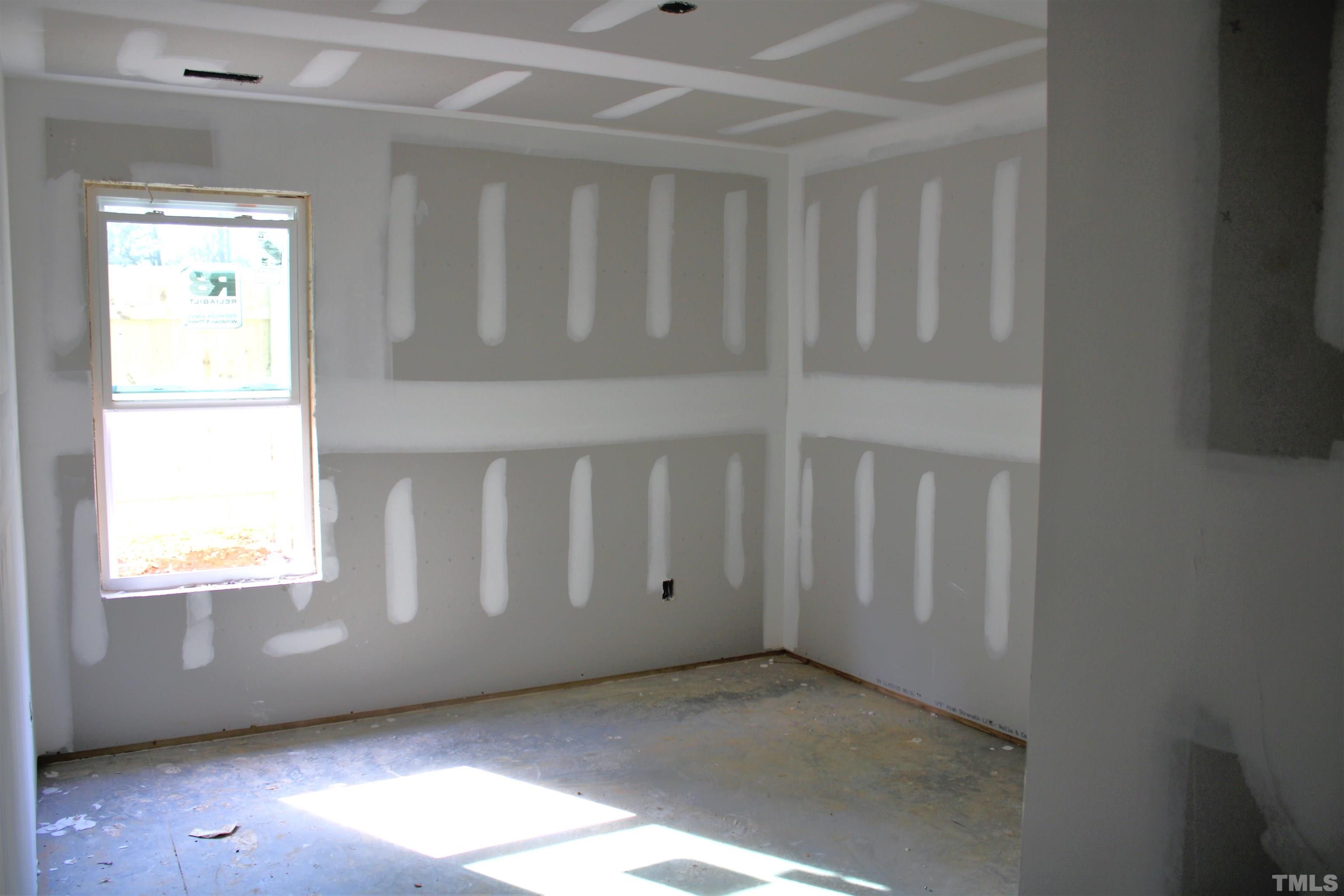 110 Alcott Street Sanford, NC 27330 - Photo 9 of 20 a view of an empty room with a window