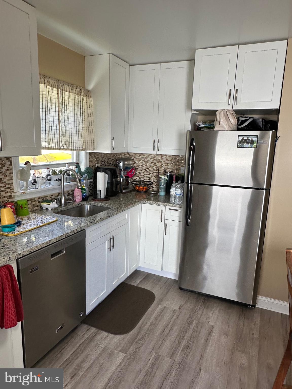29 Petty Ridge Road Hamilton, NJ 08620 - Photo 21 of 47 a kitchen with a refrigerator and a stove top oven