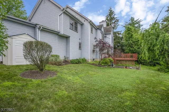 a view of a house with a yard and plants
