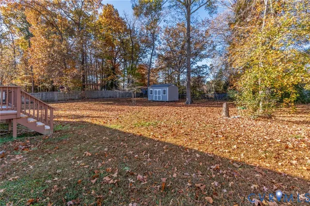 a view of a yard with trees