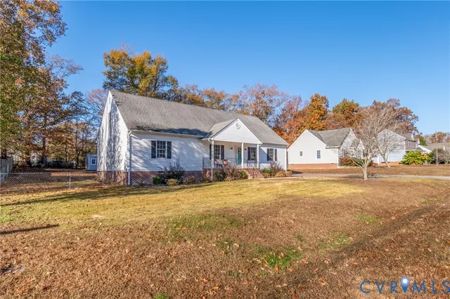 a front view of a house with a yard and a garage
