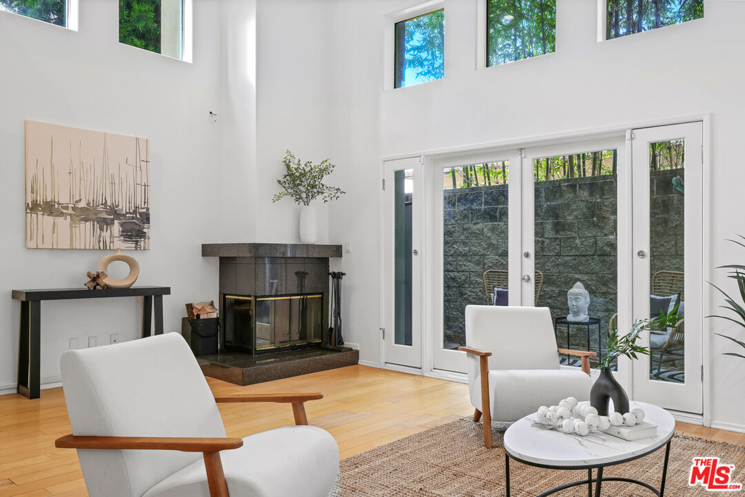 1006 Carol Drive, Unit 5 West Hollywood, CA 90069 - Photo 1 of 30 a living room with furniture a table and a large window