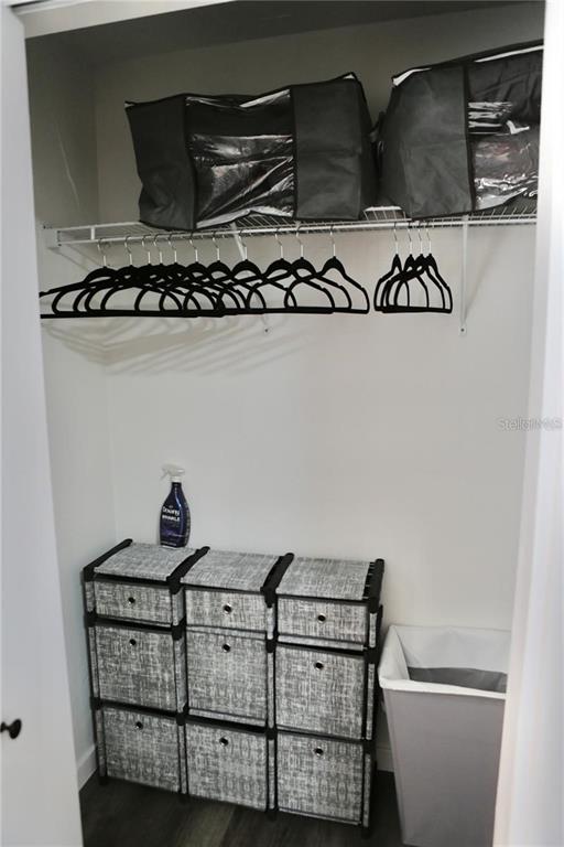 3308 Southwest 26 Way, Unit B Gainesville, FL 32608 - Photo 21 of 23 a view of a room with racks on the wall