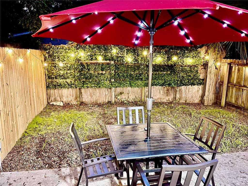 3308 Southwest 26 Way, Unit B Gainesville, FL 32608 - Photo 22 of 23 a view of a chairs and table in the patio
