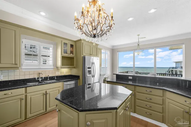 a bathroom with a sink a toilet and a shower