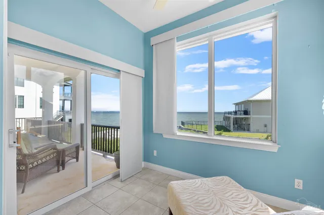 an aerial view of residential houses with outdoor space and swimming pool