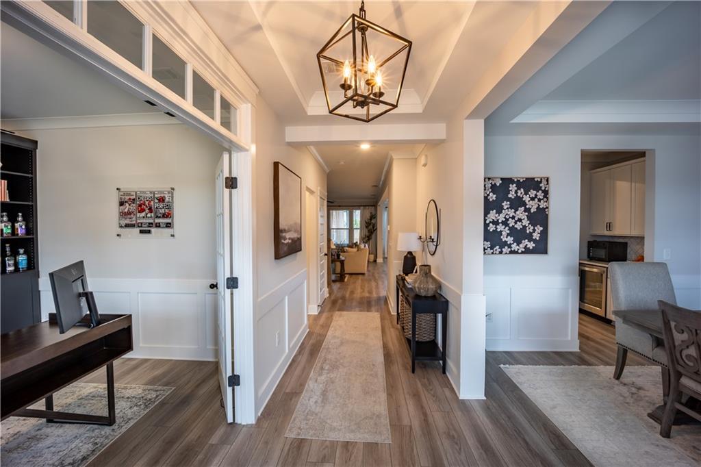 6833 Benjamin Drive Flowery Branch, GA 30542 - Photo 2 of 30 a view of a hallway view of a house and wooden floor