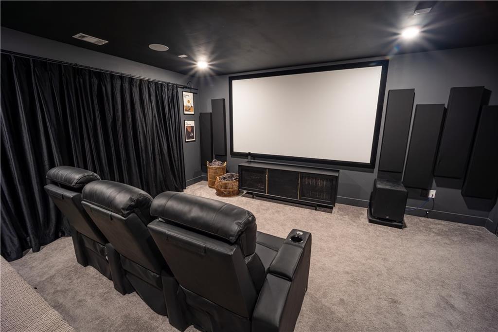 6833 Benjamin Drive Flowery Branch, GA 30542 - Photo 26 of 30 a projector room with furniture