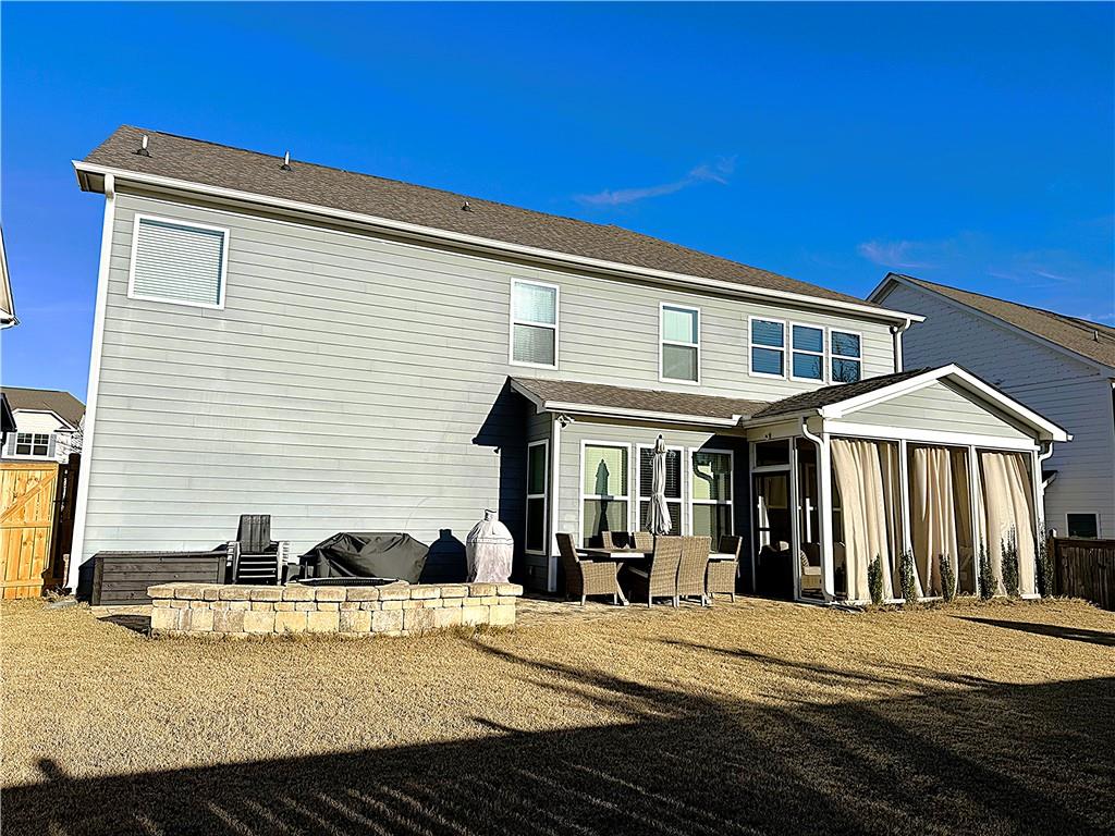 6833 Benjamin Drive Flowery Branch, GA 30542 - Photo 28 of 30 a view of a house with a patio