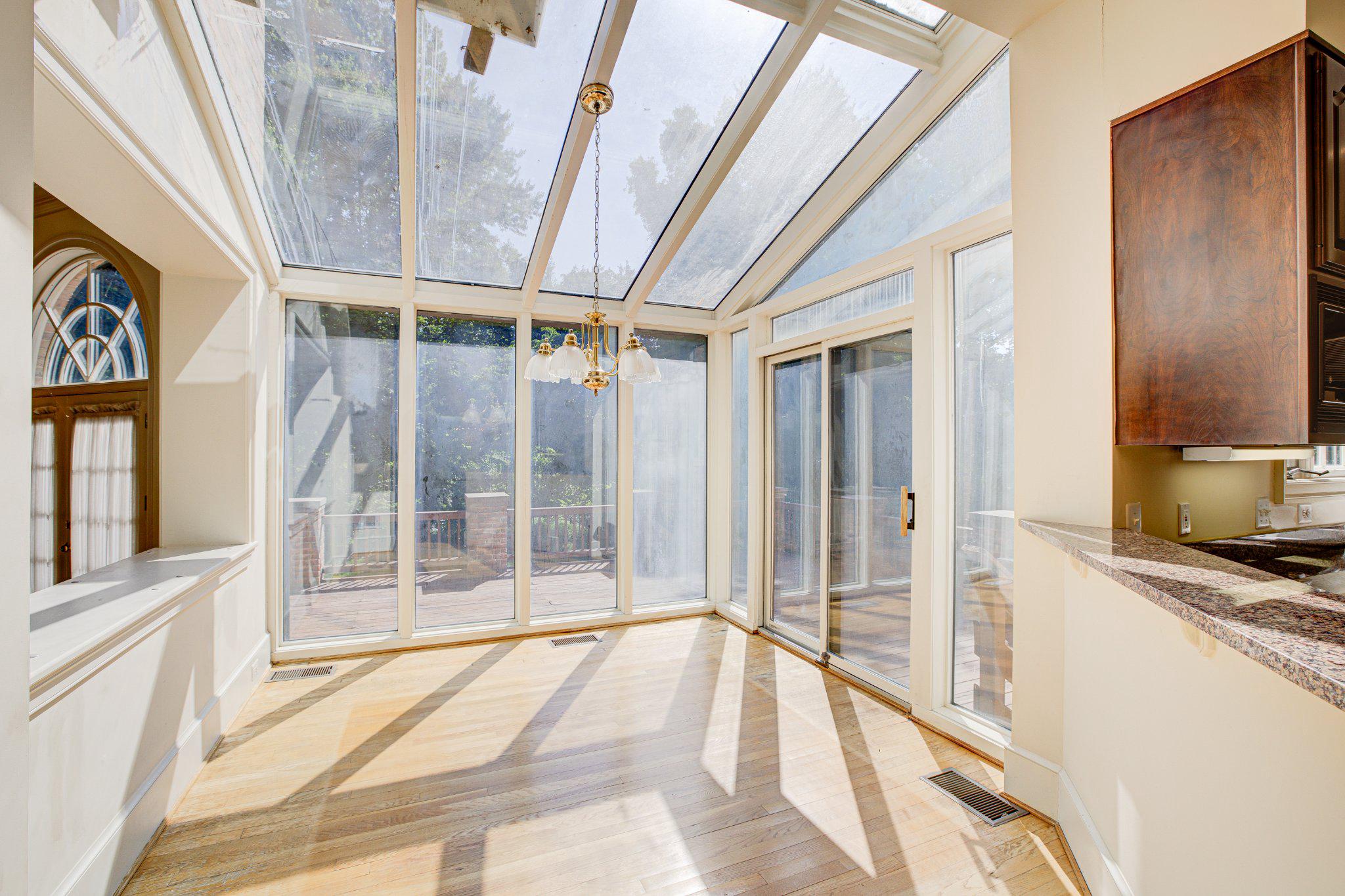 731 Utterback Store Road Great Falls, VA 22066 - Photo 7 of 19 Sunlit sunroom/conservatory with serene views.