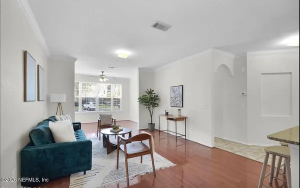 a living room with furniture and a large window