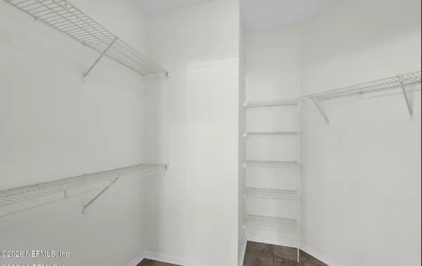 a view of an empty walk in closet