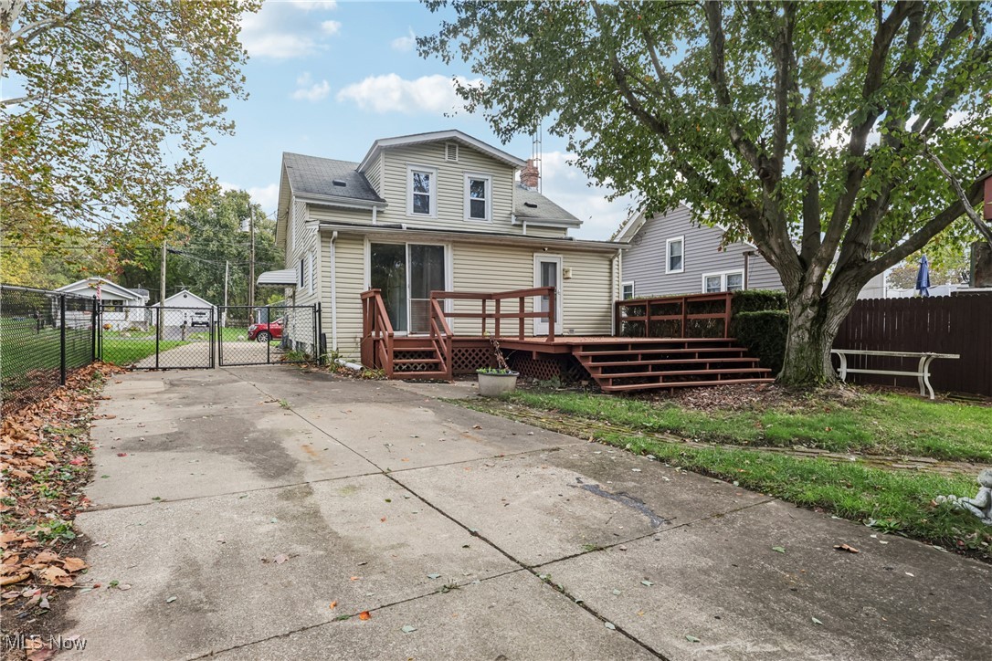 1674 Betz Road Akron, OH 44306 - Photo 2 of 29 Rear view of property with a gate, slider to deck and concrete driveway,