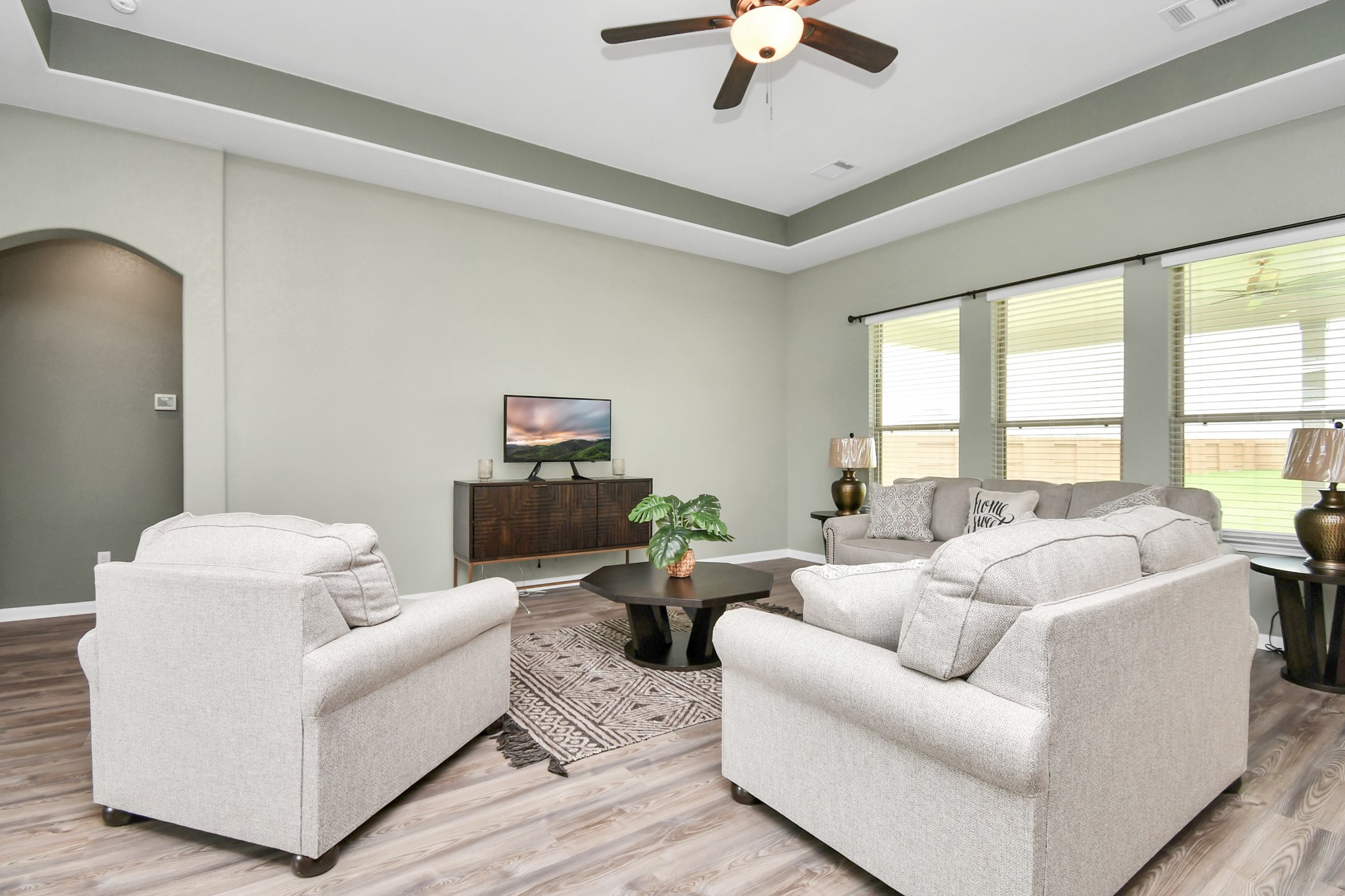 395 Hunter Ranch Way Dayton, TX 77535 - Photo 13 of 42 a living room with furniture and a large window