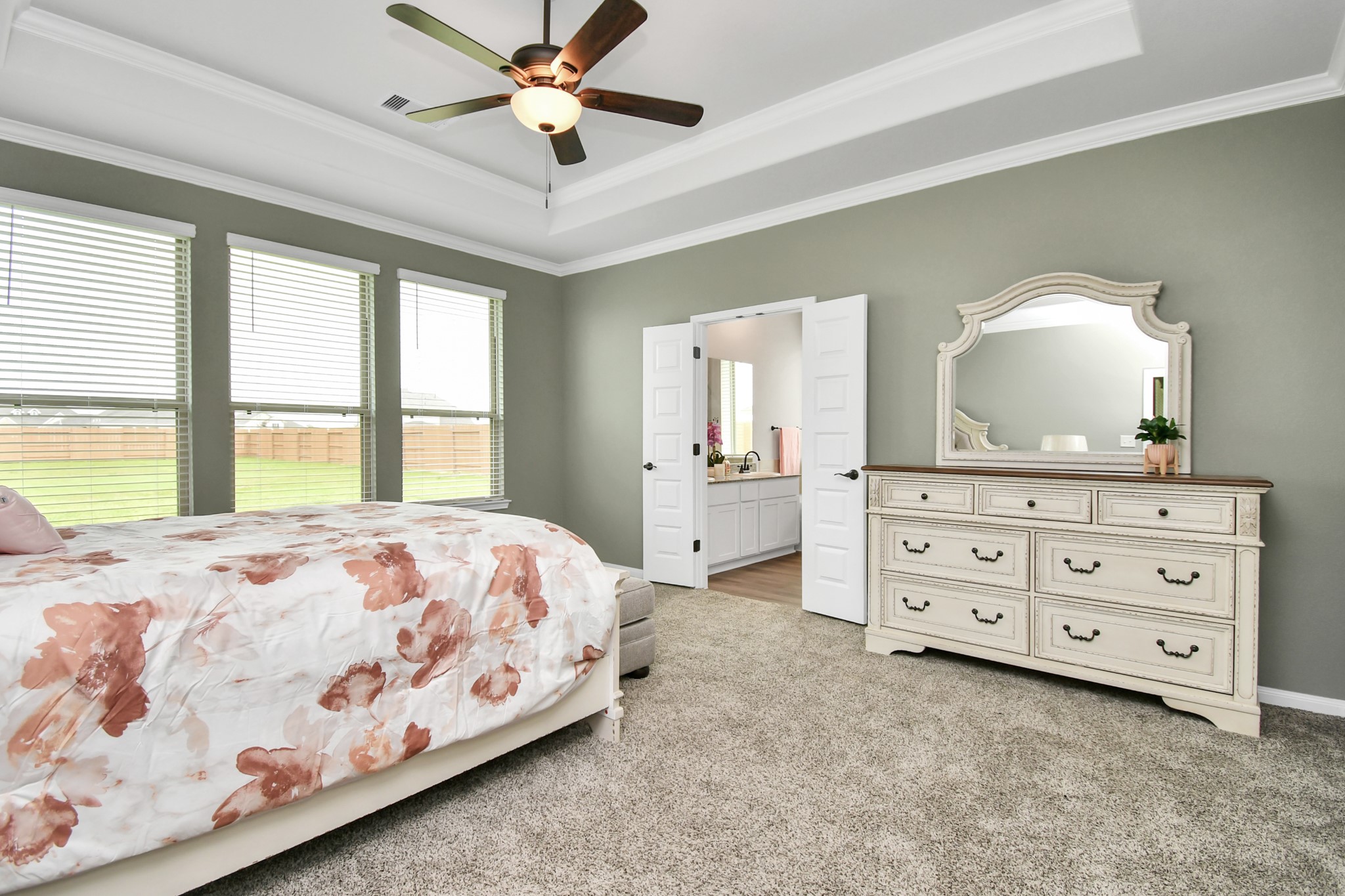 395 Hunter Ranch Way Dayton, TX 77535 - Photo 31 of 42 a bedroom with a bed and a dresser