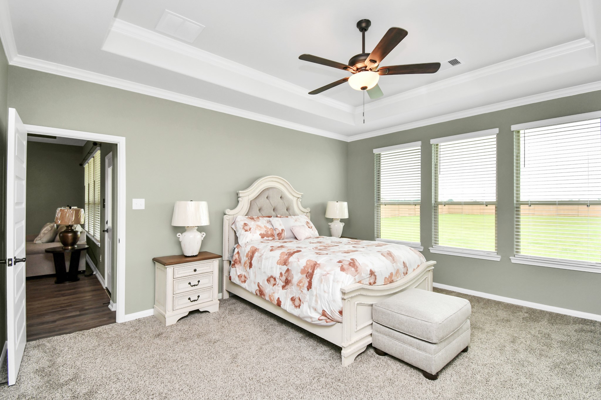 395 Hunter Ranch Way Dayton, TX 77535 - Photo 32 of 42 a bedroom with a bed gym equipment and a large window