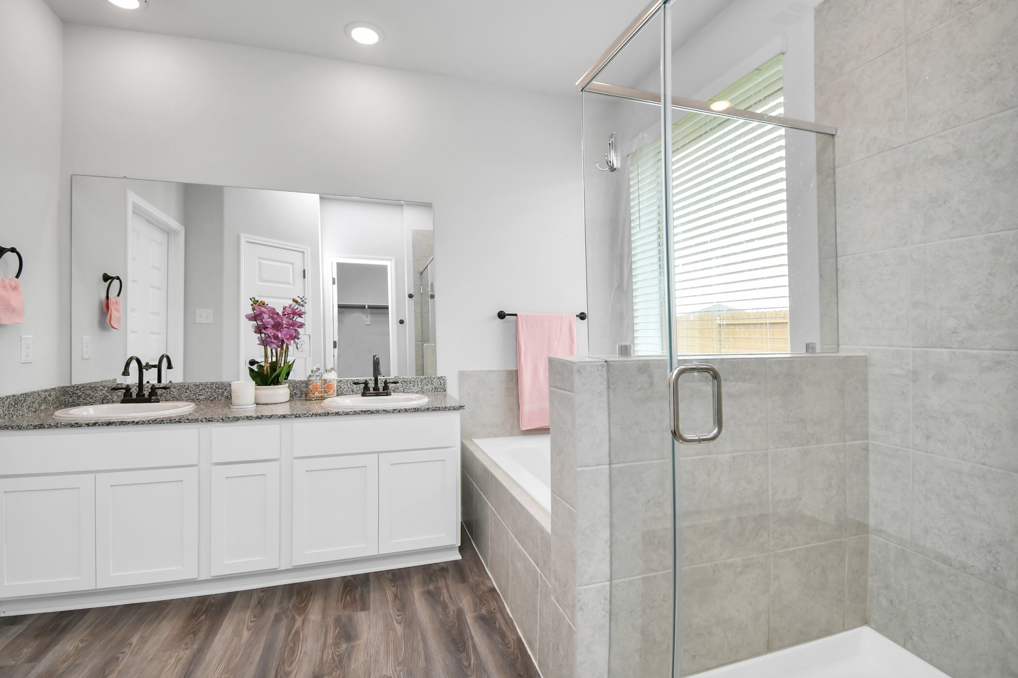 395 Hunter Ranch Way Dayton, TX 77535 - Photo 38 of 42 a bathroom with a double vanity sink mirror and shower