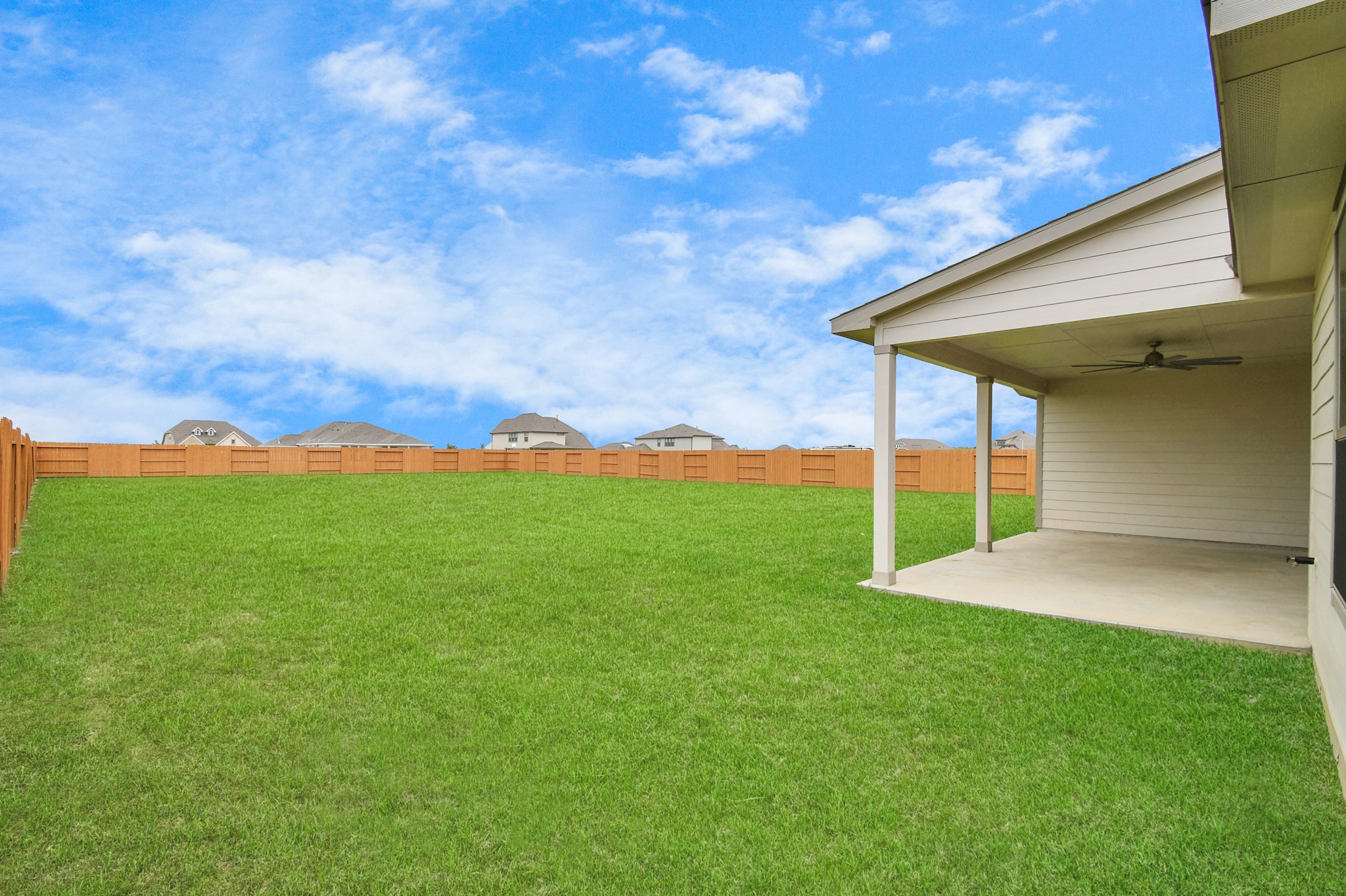 395 Hunter Ranch Way Dayton, TX 77535 - Photo 41 of 42 a view of an house with backyard space and garden