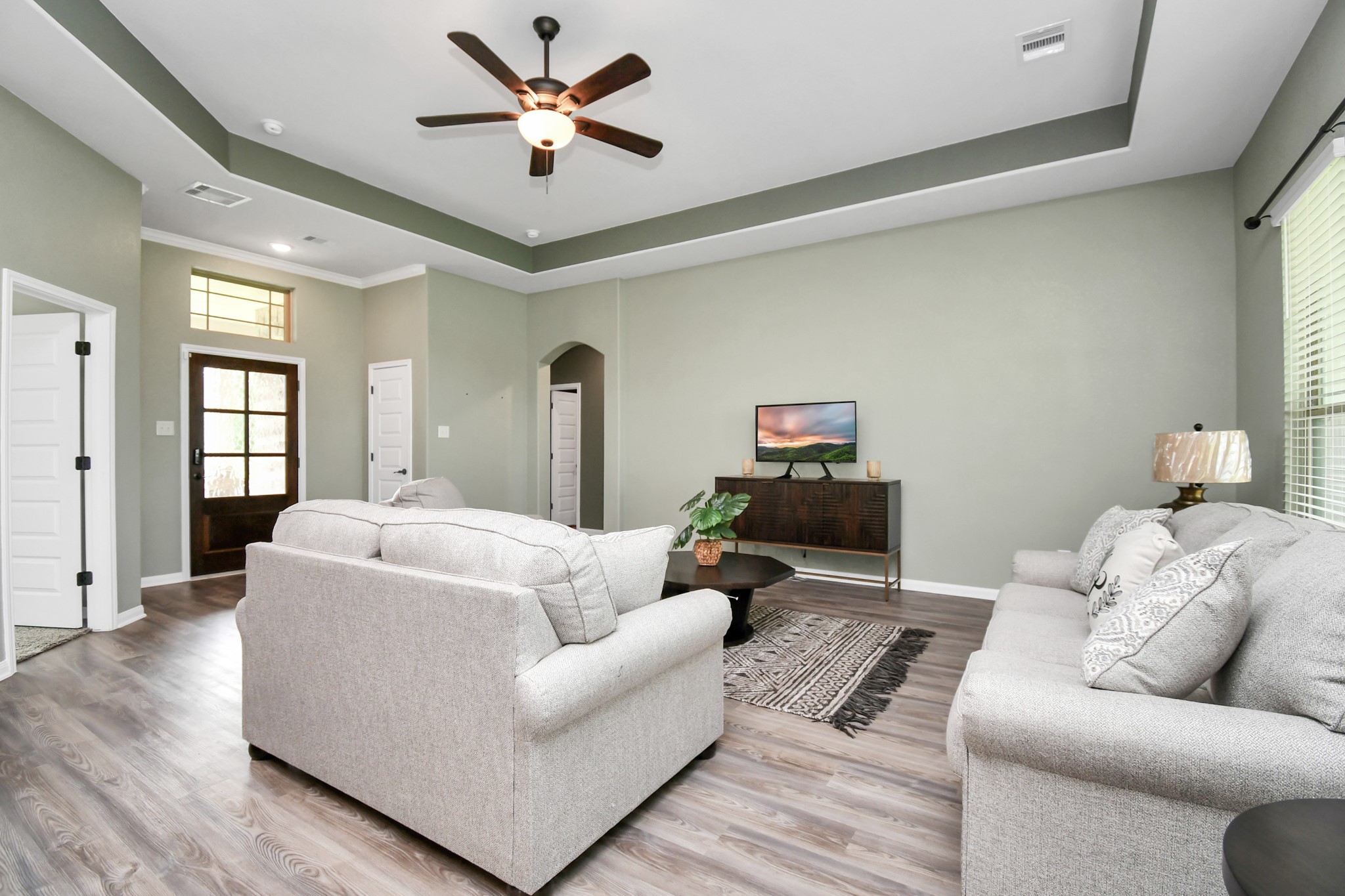 395 Hunter Ranch Way Dayton, TX 77535 - Photo 10 of 42 a living room with furniture and a wooden floor