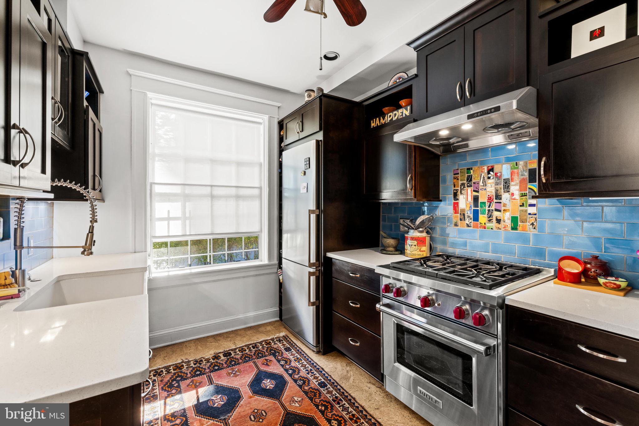 4300 Roland Avenue, Unit 101 Baltimore, MD 21210 - Photo 17 of 41 a kitchen with stainless steel appliances granite countertop a stove and a sink