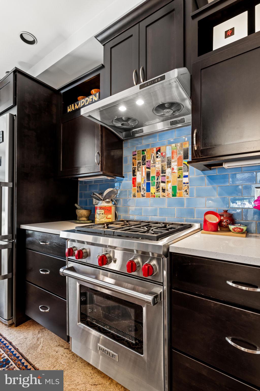 4300 Roland Avenue, Unit 101 Baltimore, MD 21210 - Photo 18 of 41 a kitchen with a stove and a microwave