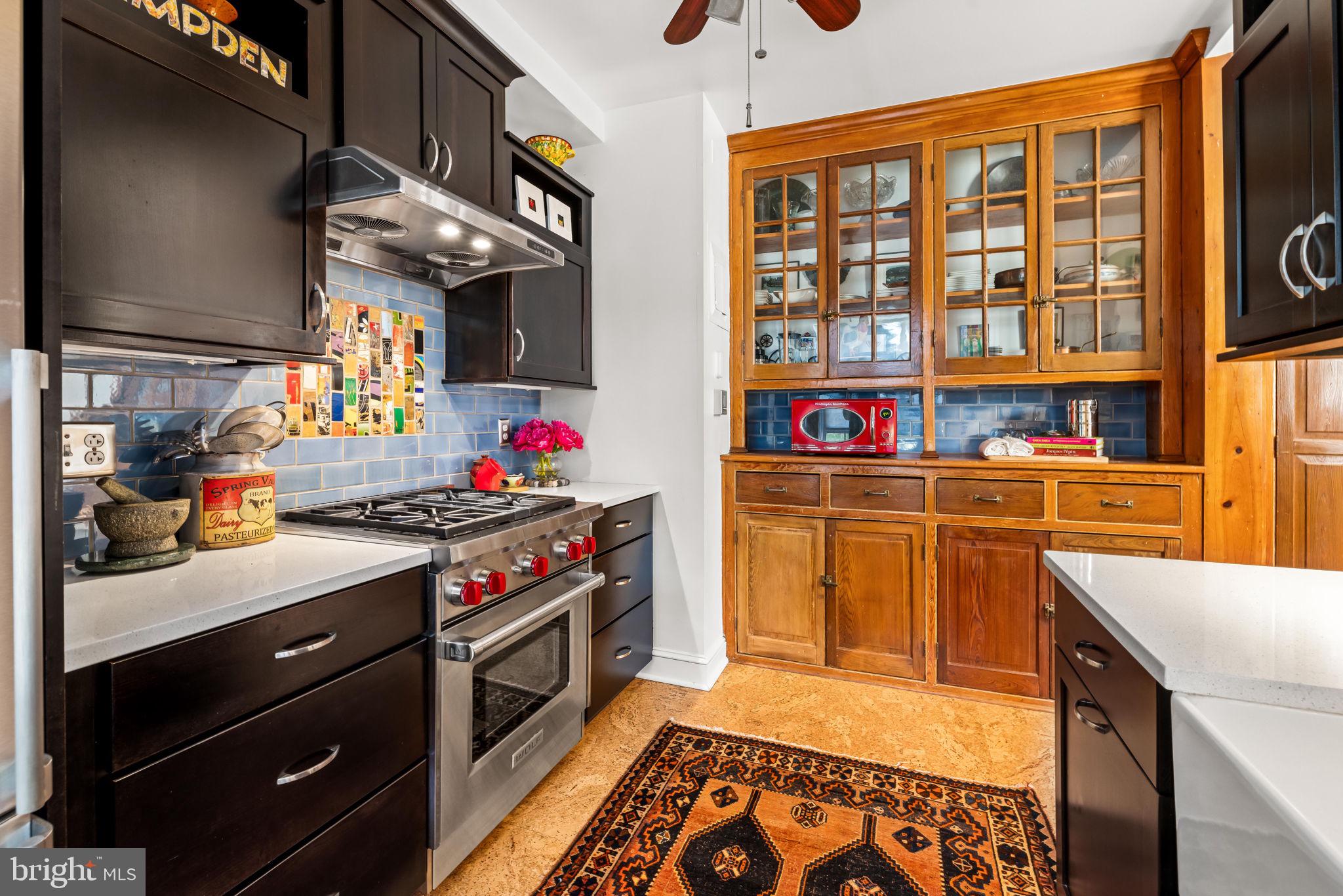 4300 Roland Avenue, Unit 101 Baltimore, MD 21210 - Photo 19 of 41 a kitchen with stainless steel appliances granite countertop a stove and a sink