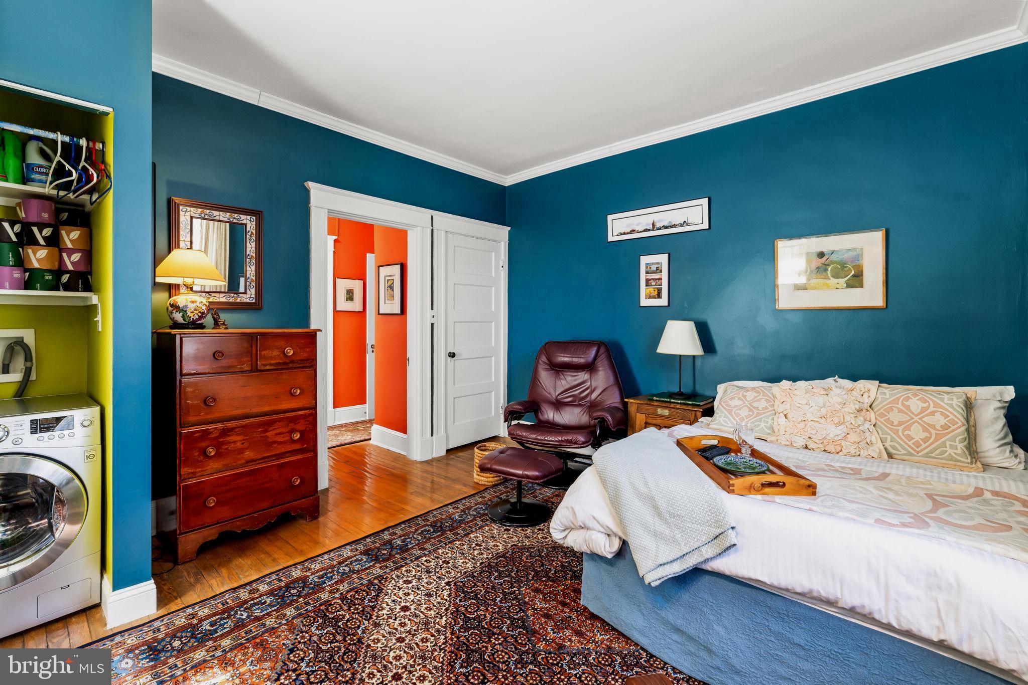 4300 Roland Avenue, Unit 101 Baltimore, MD 21210 - Photo 25 of 41 a bed sitting in a bedroom next to a window