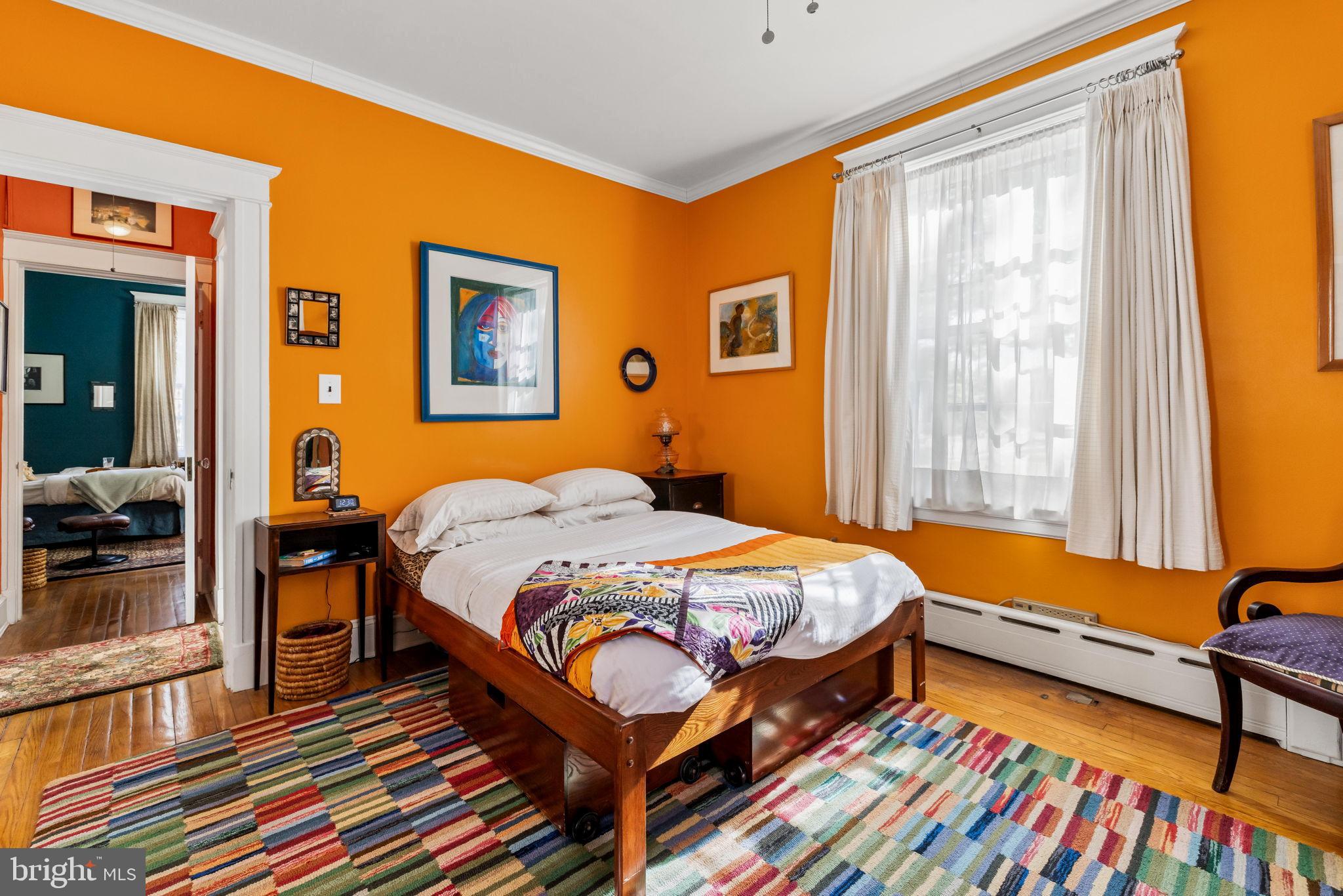 4300 Roland Avenue, Unit 101 Baltimore, MD 21210 - Photo 27 of 41 a bedroom with bed and wooden floor