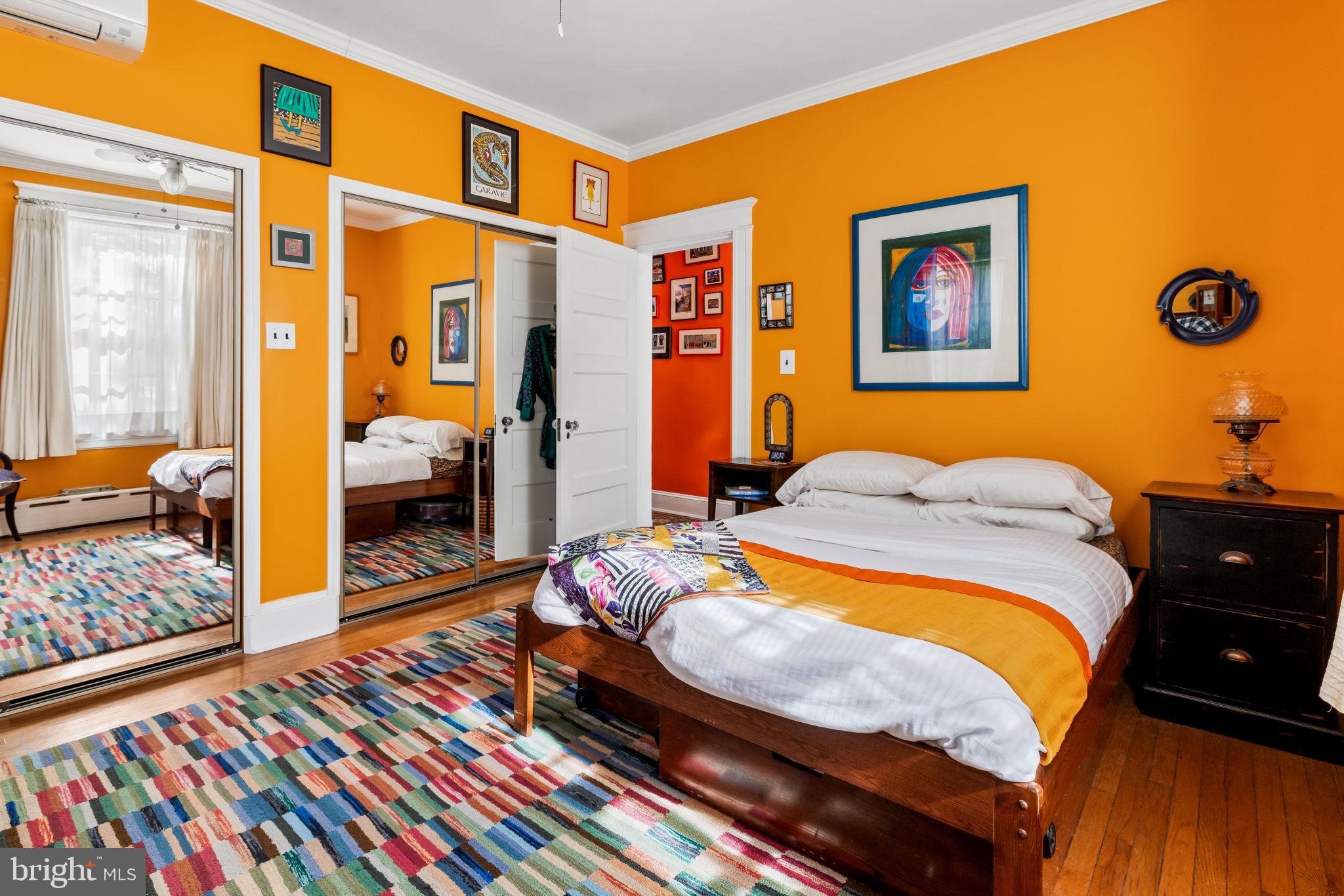 4300 Roland Avenue, Unit 101 Baltimore, MD 21210 - Photo 28 of 41 a bedroom with bed and wooden floor