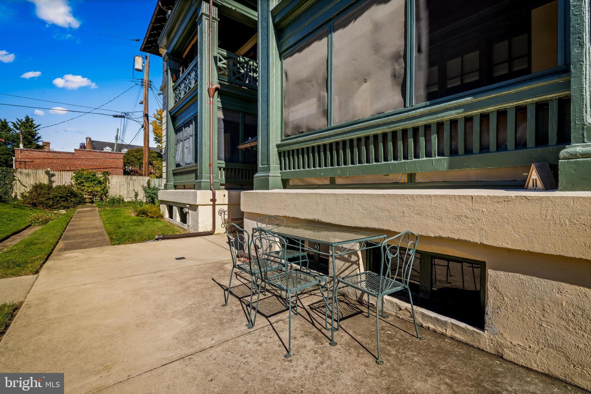 4300 Roland Avenue, Unit 101 Baltimore, MD 21210 - Photo 37 of 41 a view of a chairs and table in the patio