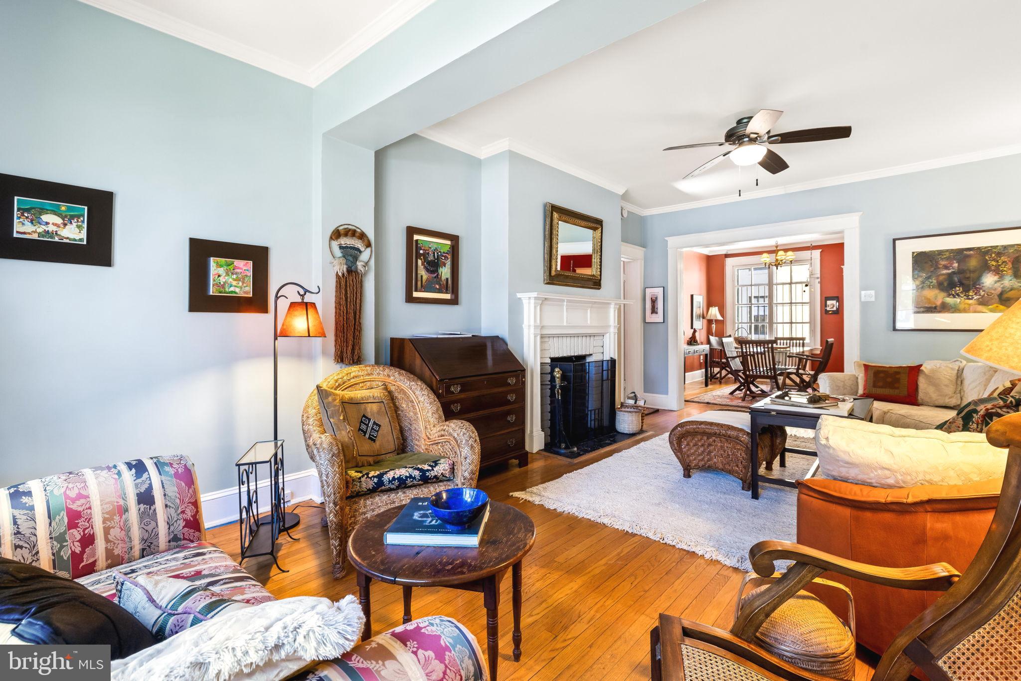 4300 Roland Avenue, Unit 101 Baltimore, MD 21210 - Photo 6 of 41 a living room with furniture and a fireplace