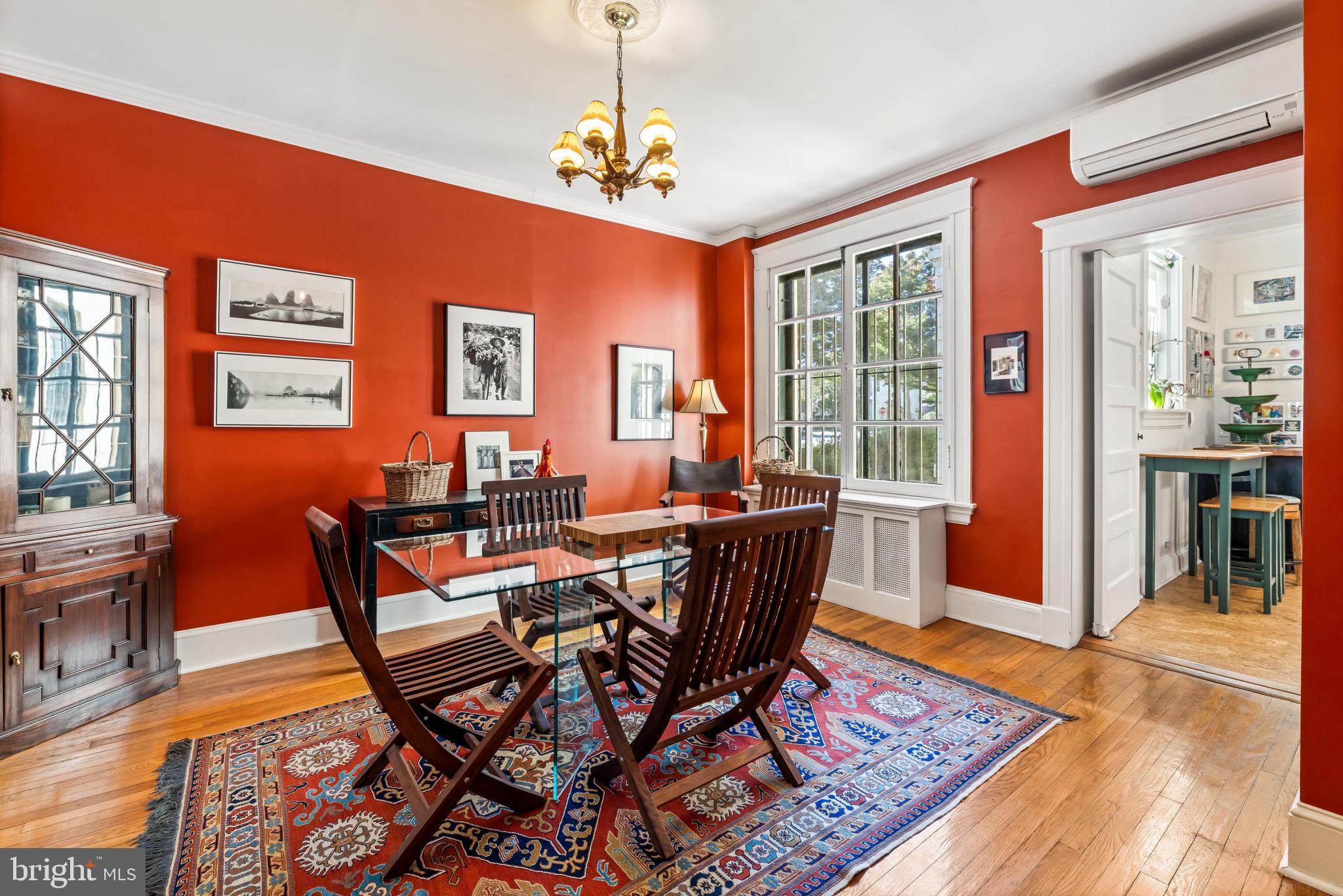 4300 Roland Avenue, Unit 101 Baltimore, MD 21210 - Photo 10 of 41 a view of a dining room with furniture window and wooden floor