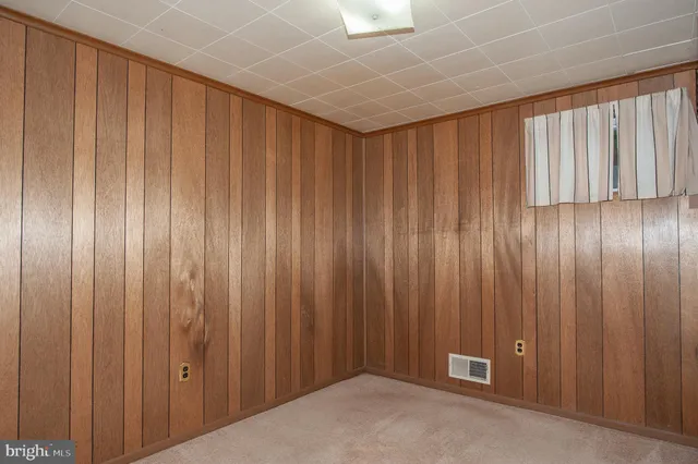 a view of a elevator with wooden walls