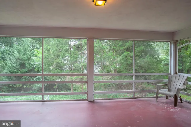a view of outdoor space with deck and a garden