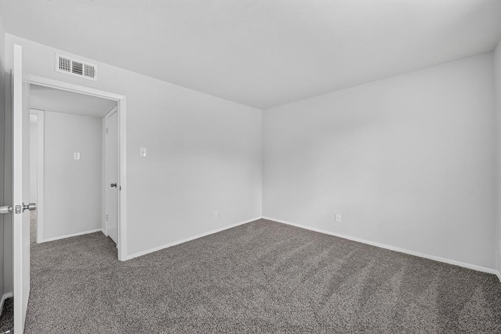 1801 East Grauwyler Road, Unit 101 Irving, TX 75061 - Photo 22 of 39 a view of an empty room